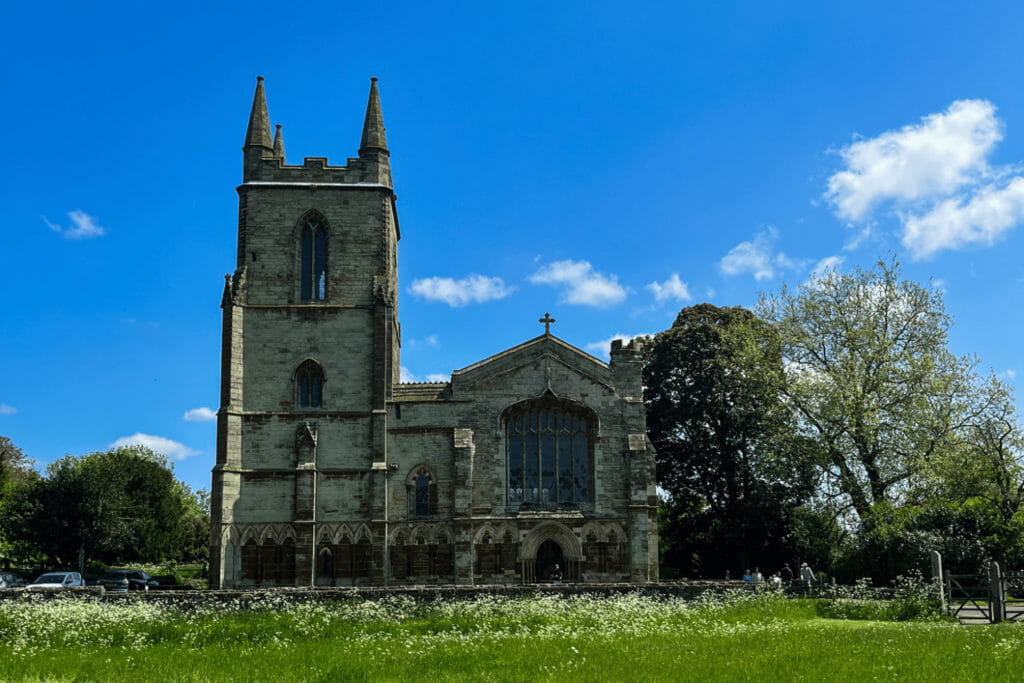 Canons Ashby Church with a blue sky in the background
