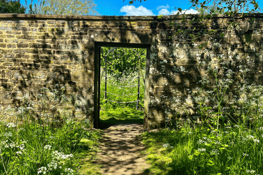 Archway in the wall at Canons Ashby Gardens
